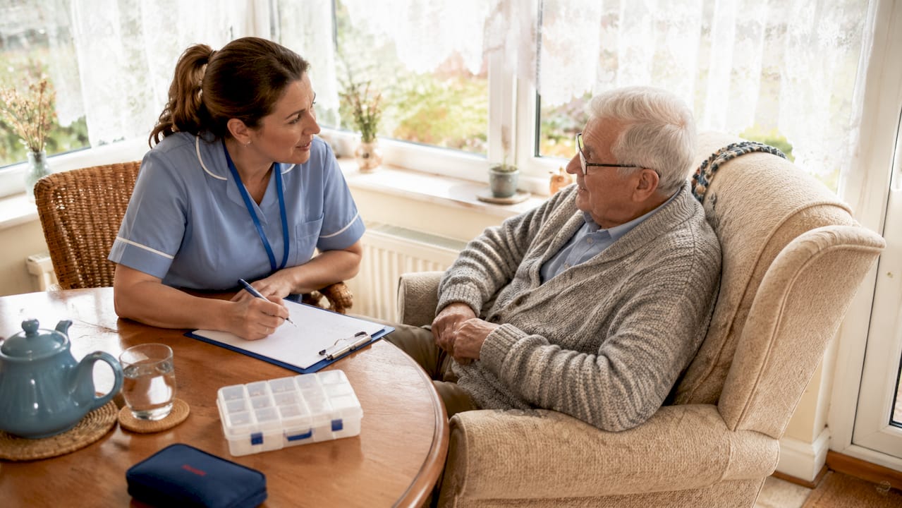 Nurse conducting a home care assessment in living room