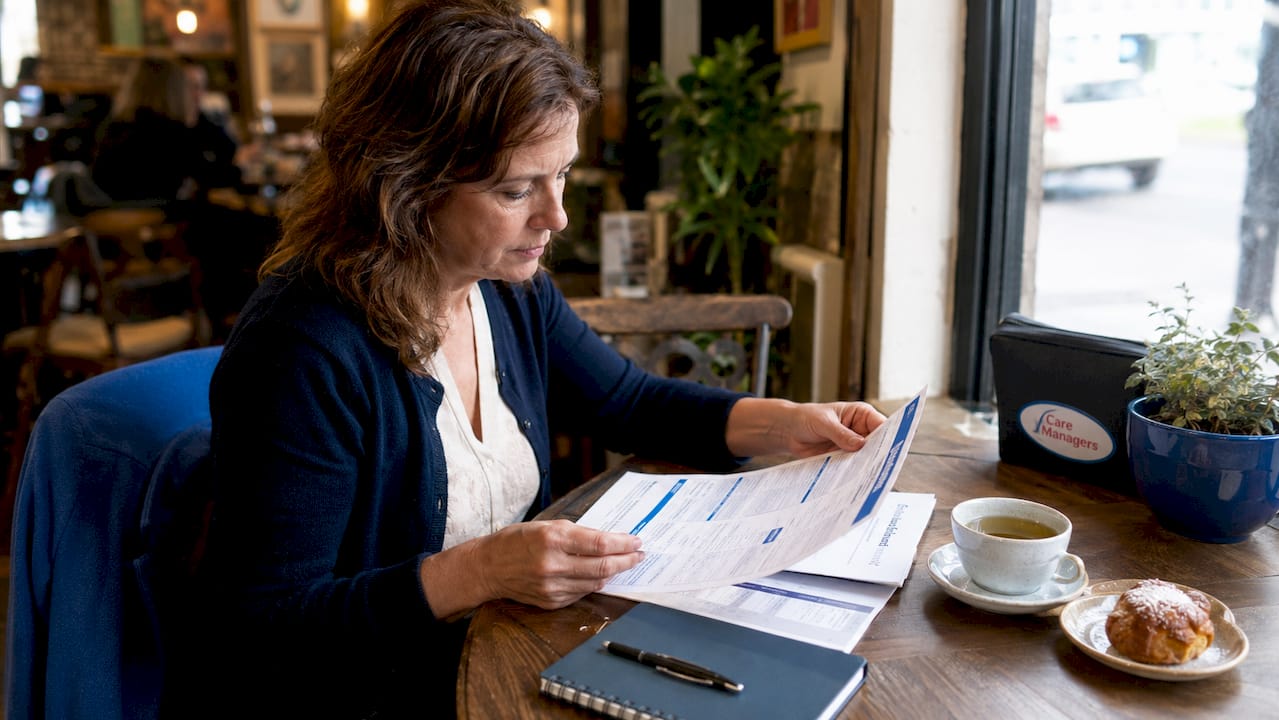 Woman organising emergency care plan documents